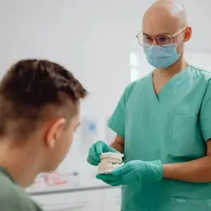 Dentist talking to a patient